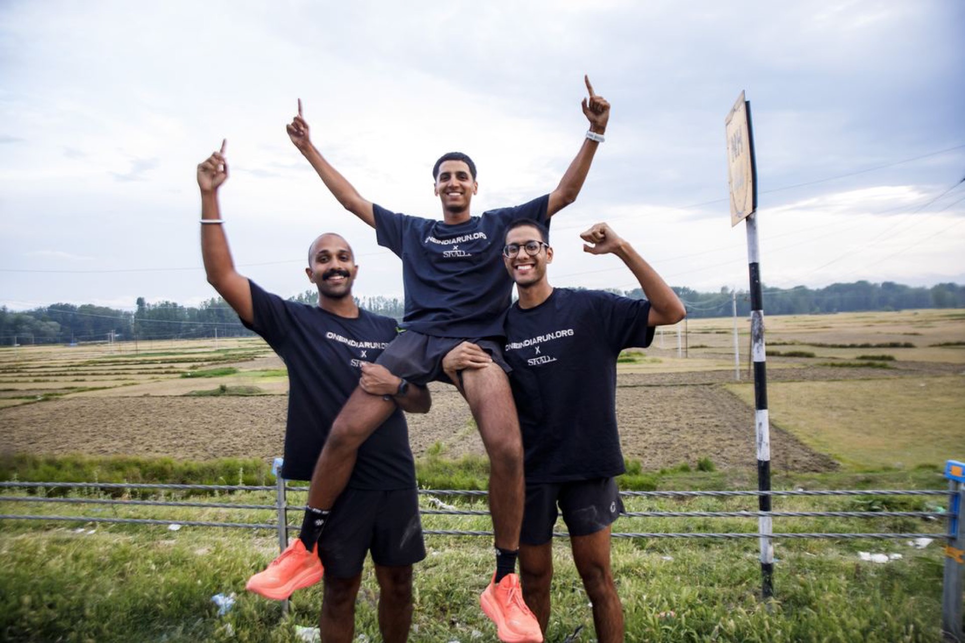 Celebrating with the crew in the rice fields near the finish