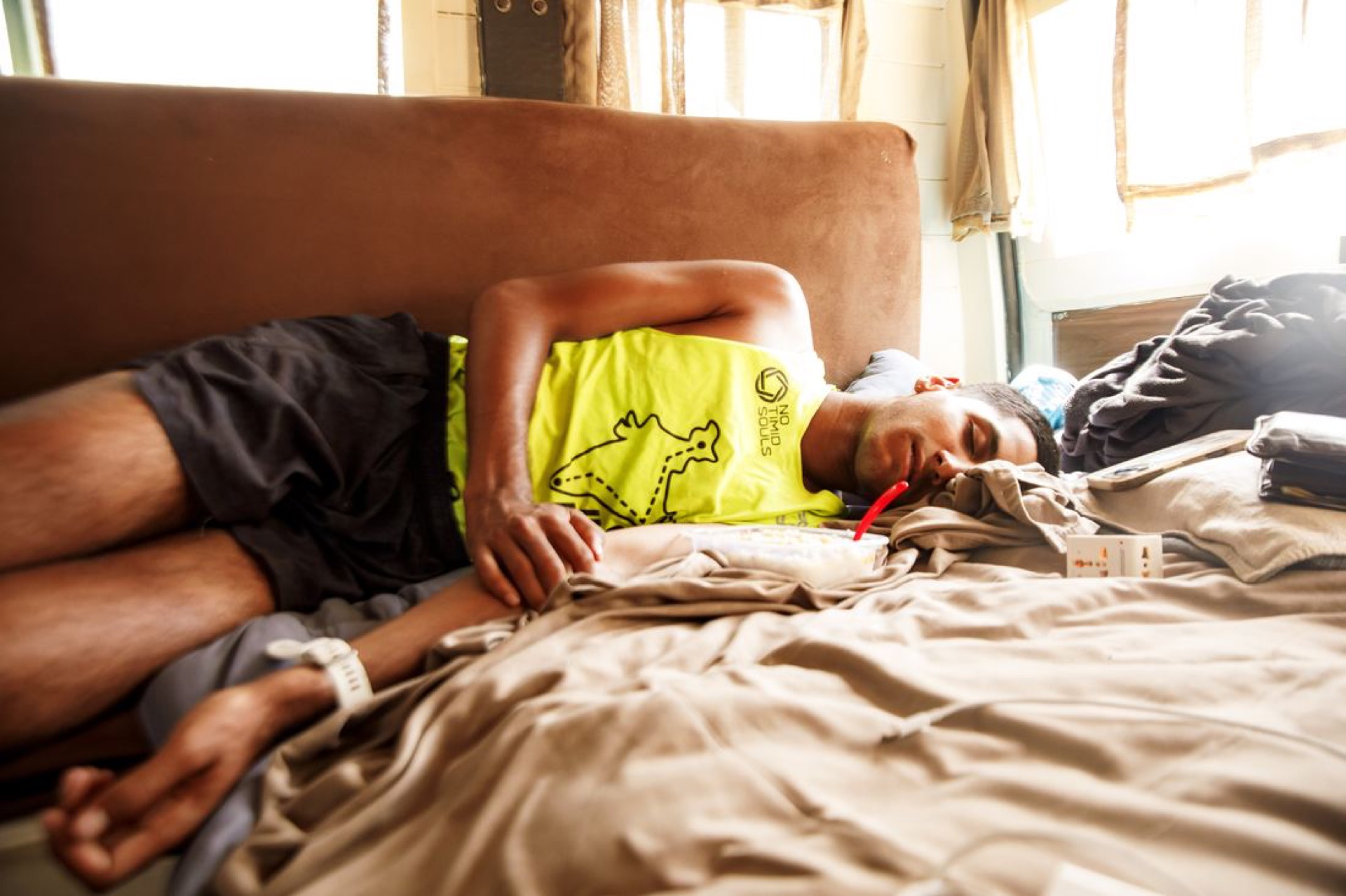 Catching sleep in the RV between stages