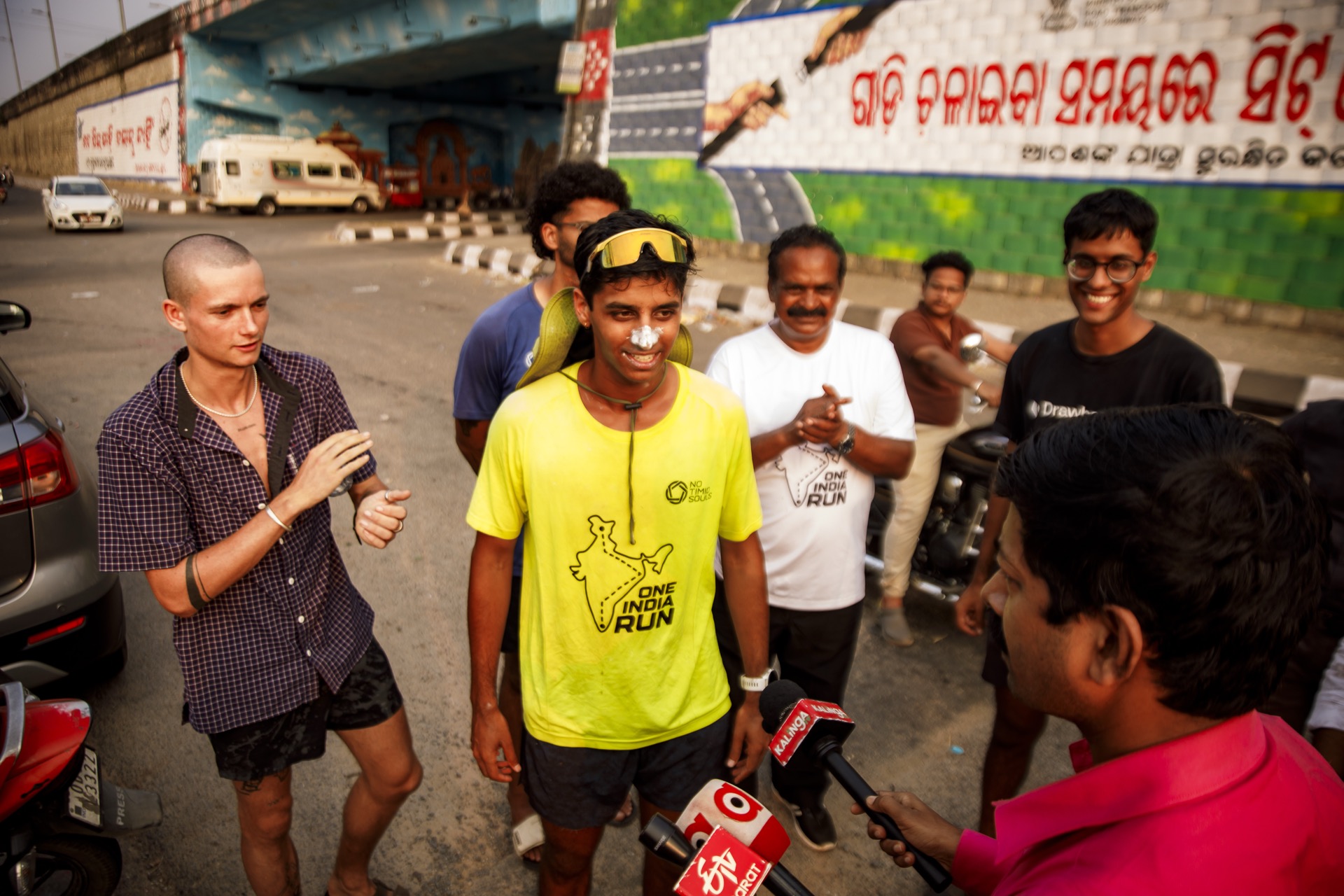 A press interview under a flyover in Bhubaneswar
